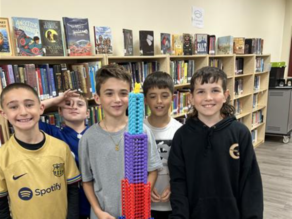 4 boys build a tower